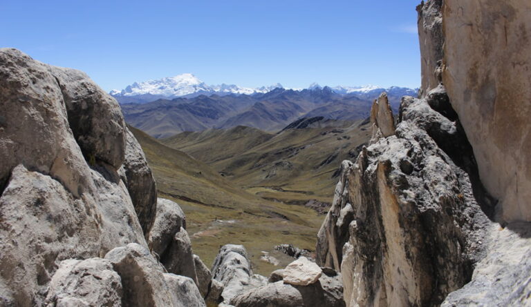 Palccoyo rainbow mountain tour - stone fores and the Ausangate snow-capped mountain